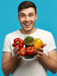 happy-young-vegetarian-posing-blue-wall-with-glass-bowl-fresh-organic-vegetables-that-he-grew-himself-his-farm-having-excited-facial-expression-keeping-mouth-wide-opened_343059-4842