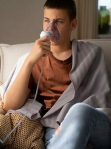 view-teenage-boy-using-nebulizer-home-respiratory-health-problems_23-2150573999