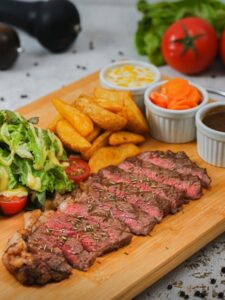 free-photo-of-tray-with-sliced-steak-salad-fries-and-dips